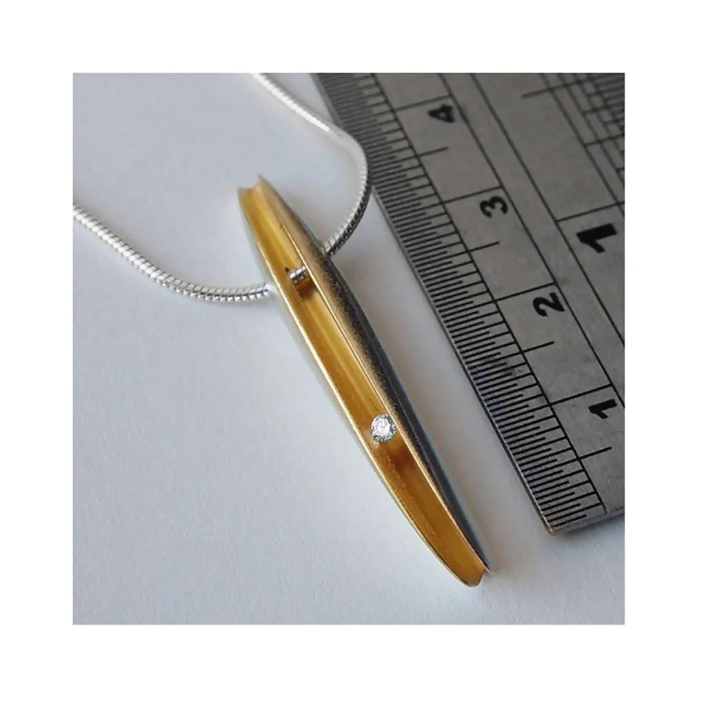 Long silver shell pendant with 3pt diamond & 22K gold plated interior